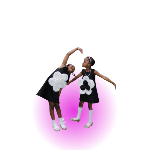 Young girls playing while wearing high fashion dresses