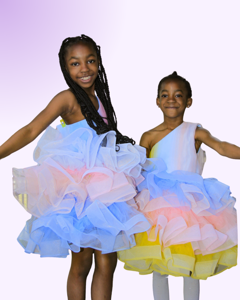 Preteen girls showing off violets content African dresses